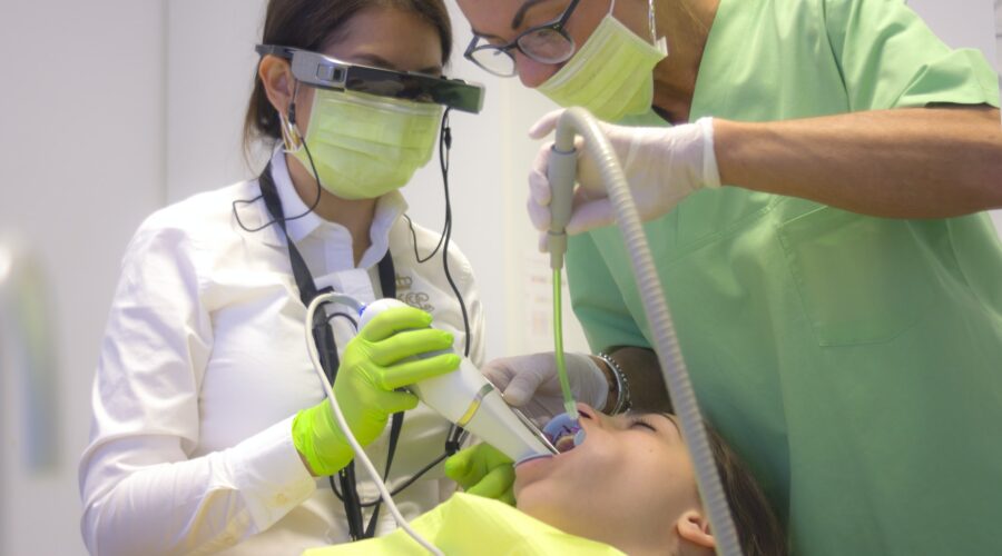 dentist using Intraoral Scanner and Smart View Glasses AR